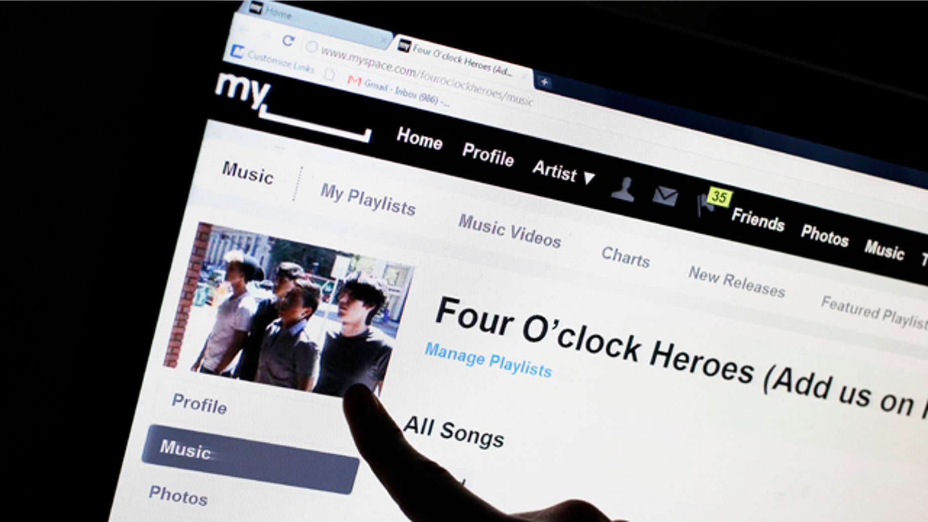 June 29, 2011: Bass guitarist Cameron Schnittger, with the pop rock band Four O'clock Heroes, points to his picture on on the bands' MySpace web site page in San Jose, Calif. News Corp. has sold the struggling social networking site for $35 million, mostly in stock, according to a person familiar with the matter.