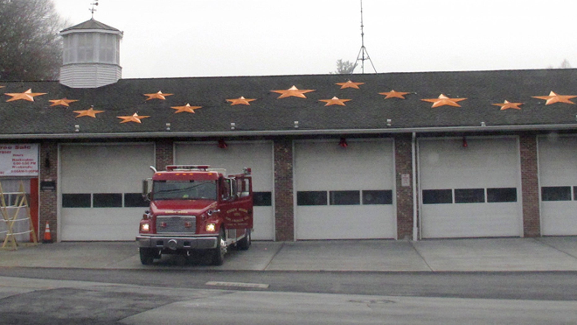In this Friday, Dec. 11, 2015 photo, 26 stars decorate the roof of the Sandy Hook Volunteer Fire & Rescue Co. firehouse in Newtown, Conn. The stars are in memory of the victims of the Dec. 14, 2012 shooting at the adjacent to Sandy Hook Elementary School where 20 students and six adults were killed.