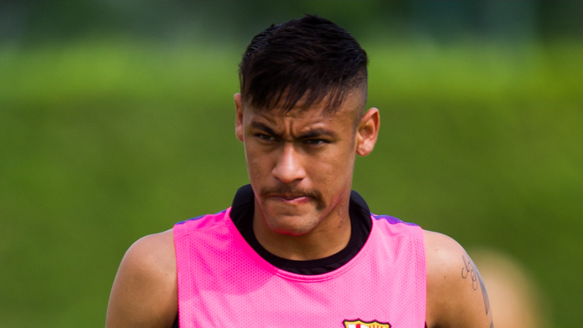 BARCELONA, SPAIN - AUGUST 17: Neymar looks on during a FC Barcelona training session at Ciutat Esportiva on August 17, 2014 in Barcelona, Spain. (Photo by Alex Caparros/Getty Images)