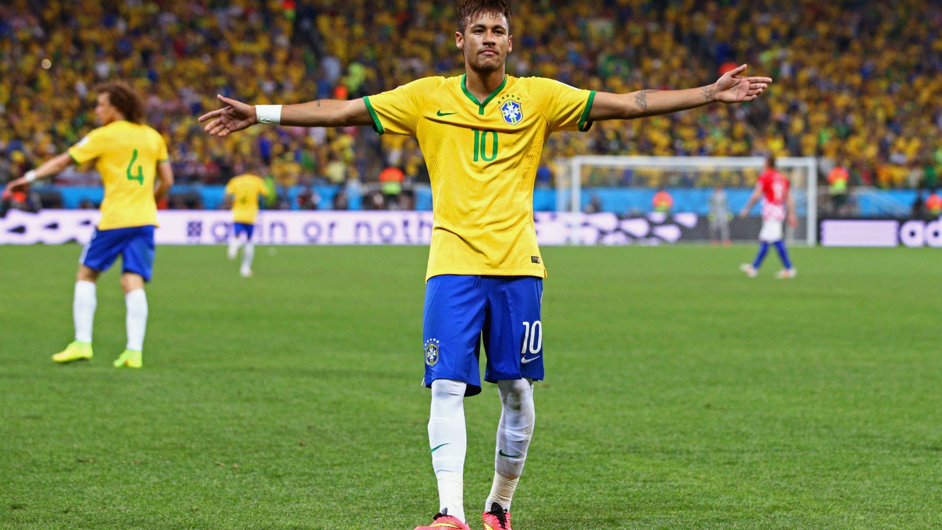 SAO PAULO, BRAZIL - JUNE 12: Neymar of Brazil celebrates after scoring his second goal on a penalty kick in the second half during the 2014 FIFA World Cup Brazil Group A match between Brazil and Croatia at Arena de Sao Paulo on June 12, 2014 in Sao Paulo, Brazil. (Photo by Adam Pretty/Getty Images)