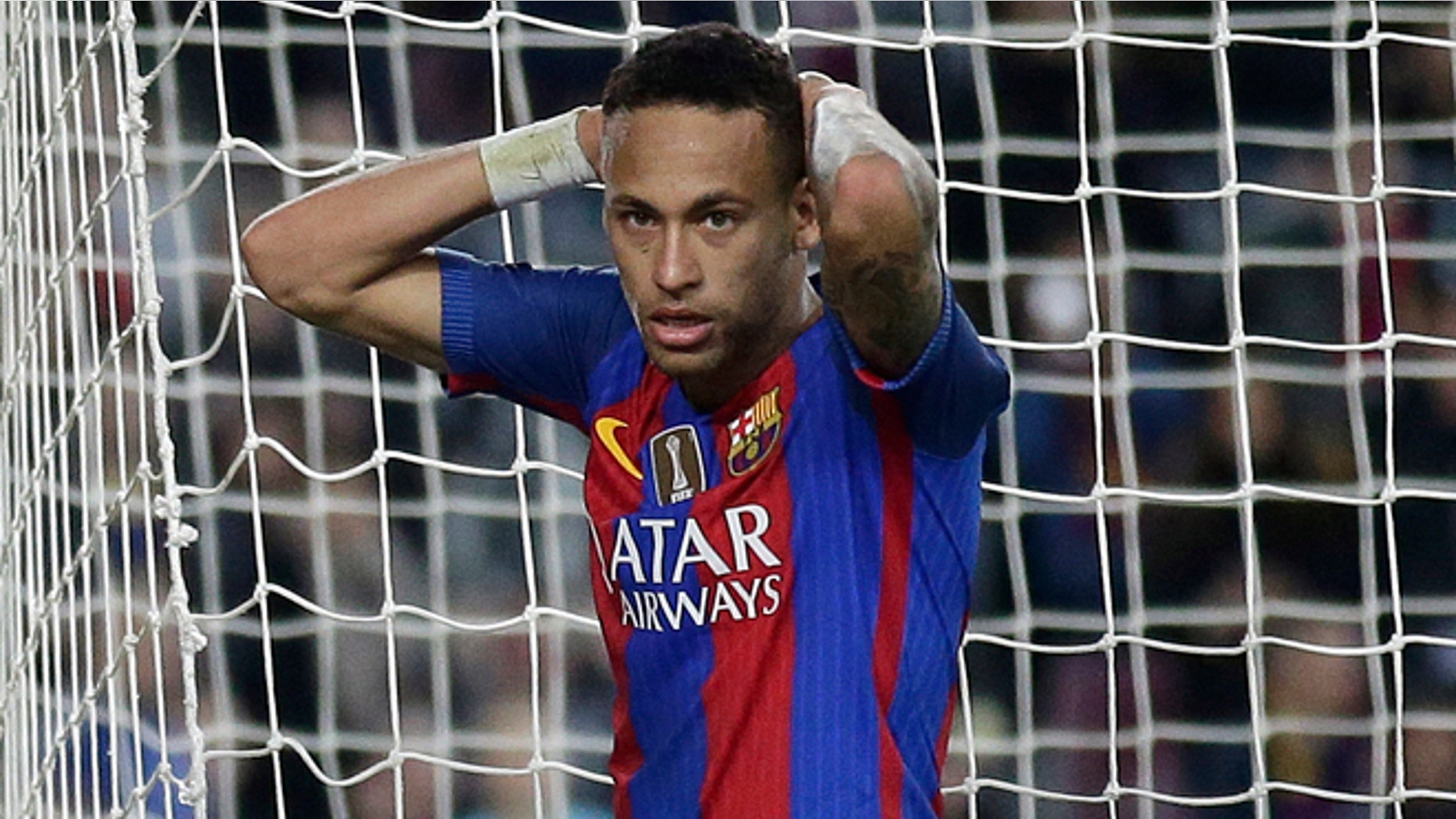 FILE - In this Saturday, Nov. 19, 2016 file photo, FC Barcelona's Neymar reacts during the Spanish La Liga soccer match between FC Barcelona and Malaga at the Camp Nou in Barcelona, Spain. Spanish prosecutors are seeking a two-year prison sentence and a $10.6 million fine for Neymar on corruption charges because of alleged irregularities during his transfer from Brazilian club Santos to Barcelona, it was reported on Wednesday, Nov. 23, 2016. (AP Photo/Manu Fernandez, File)