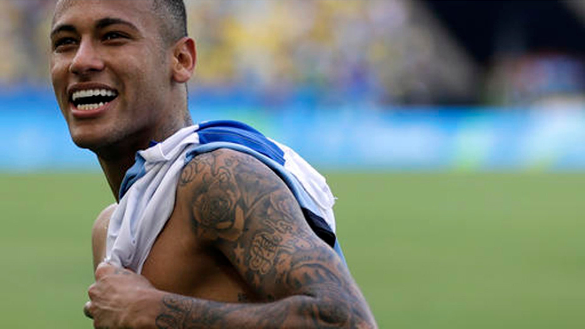 Brazil's Neymar smiles at the end of a semifinal match of the men's Olympic football tournament between Brazil and Honduras at the Maracana stadium in Rio de Janeiro Wednesday Aug. 17, 2016. Brazil won the match 6-0 and qualified for the final.(AP Photo/Felipe Dana)