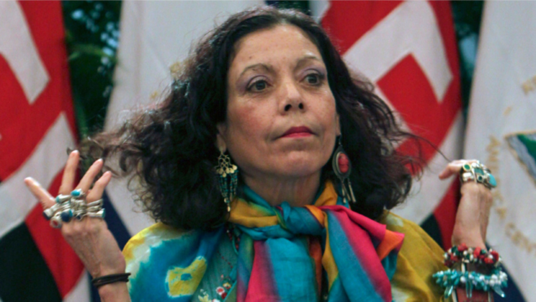 FILE - In this Oct. 29, 2011 file photo, Nicaragua's first lady Rosario Murillo, attends a press conference in Managua, Nicaragua. Murillo is beloved by many poor Nicaraguans and Sandinista faithful, consistently polling around 70 percent approval. And shes equally reviled by government opponents, who see her presence on the ticket as another step in the 70-year-old Ortegas push to maintain the couples grip on power in a country with a long and uncomfortable history of dynastic families. (AP Photo/Miguel Alvarez, File)