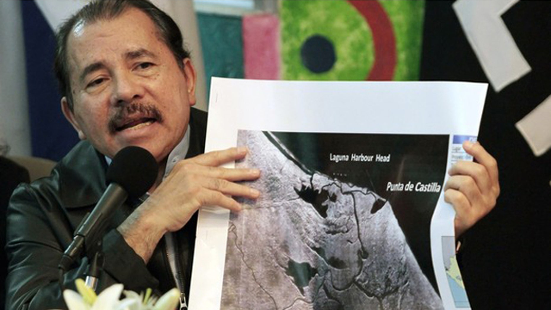 Nicaragua's President Daniel Ortega shows a map referring to the territorial dispute with Costa Rica during an address to the nation in Managua November 13, 2010. The Organization of American States urged Nicaragua and Costa Rica on Saturday to withdraw their security forces from a disputed river border in a spat that forced Google to correct its maps of the area.