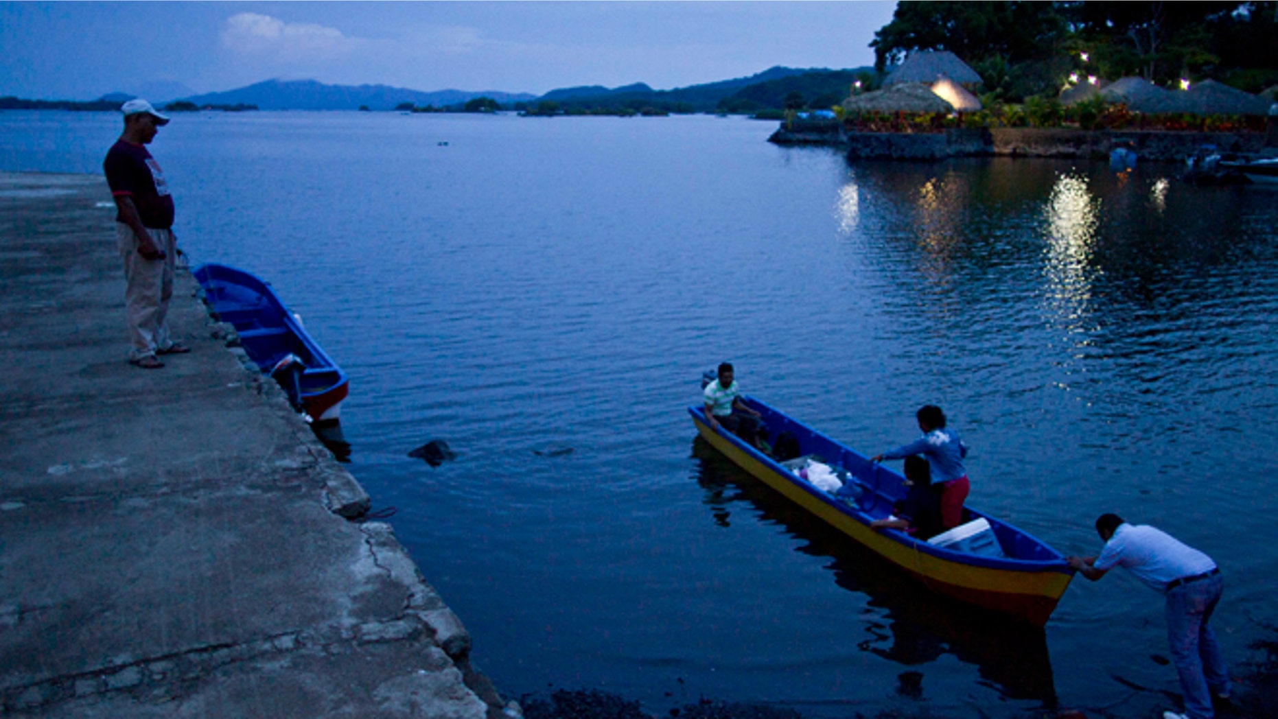 June 7, 2013: In this photo, people push a boat into Lake Nicaragua, near Granada, Nicaragua. A multi-billion dollar Chinese plan to plow a massive rival to the Panama Canal across the middle of Nicaragua was headed for approval by the leftist-controlled National Assembly Thursday, June 13, 2013, capping a lightning-fast approval process that has provoked deep skepticism among shipping experts and intense concern among environmentalists.