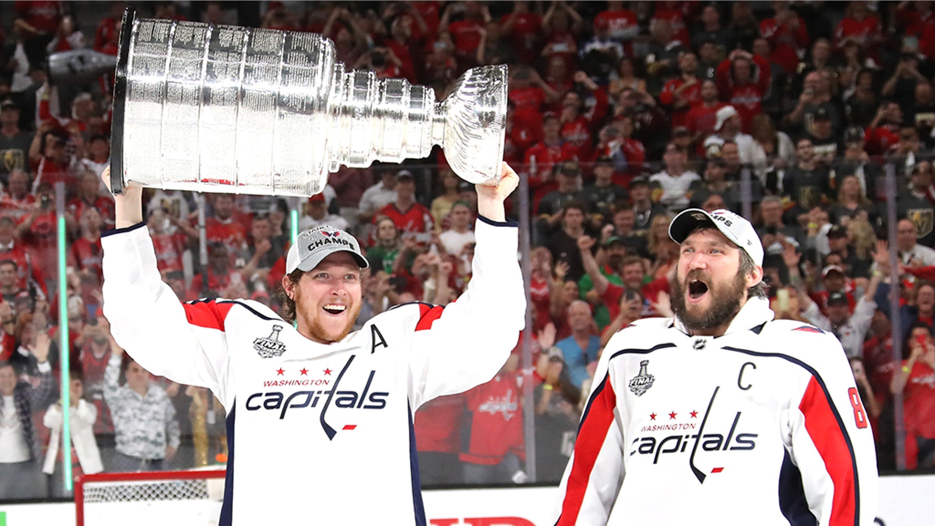 LAS VEGAS, NV - JUNE 07: Alex Ovechkin #8 hands of the Stanley Cup to Nicklas Backstrom #19 of the Washington Capitals after their team's 4-3 win over the the Vegas Golden Knights in Game Five of the 2018 NHL Stanley Cup Final at T-Mobile Arena on June 7, 2018 in Las Vegas, Nevada. (Photo by Bruce Bennett/Getty Images)