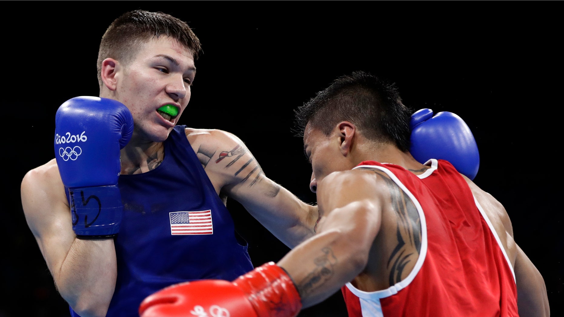 United States' Nico Miguel Hernandez, left, fights Ecuador's Carlos Eduardo Quipo Pilataxi on Aug. 10, 2016.
