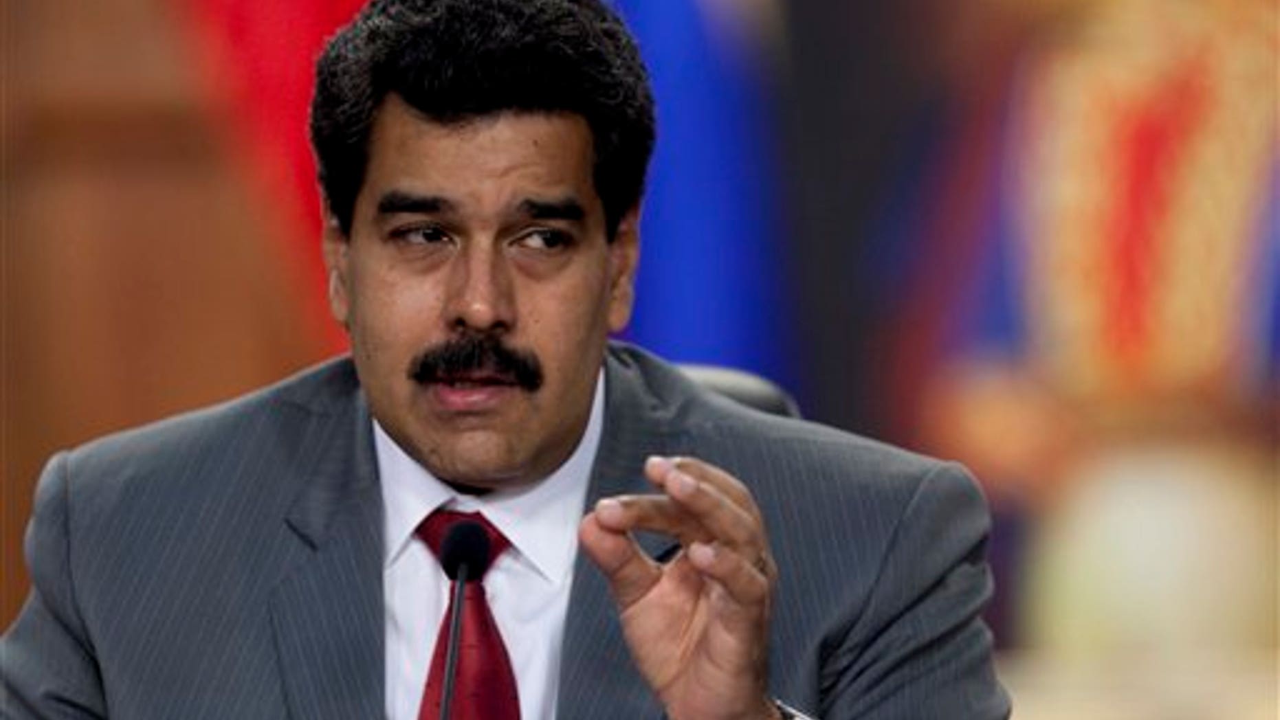 Venezuela's President Nicolás Maduro speaks during a press conference at the Miraflores presidential palace in Caracas, Venezuela, Friday, March 14, 2014.