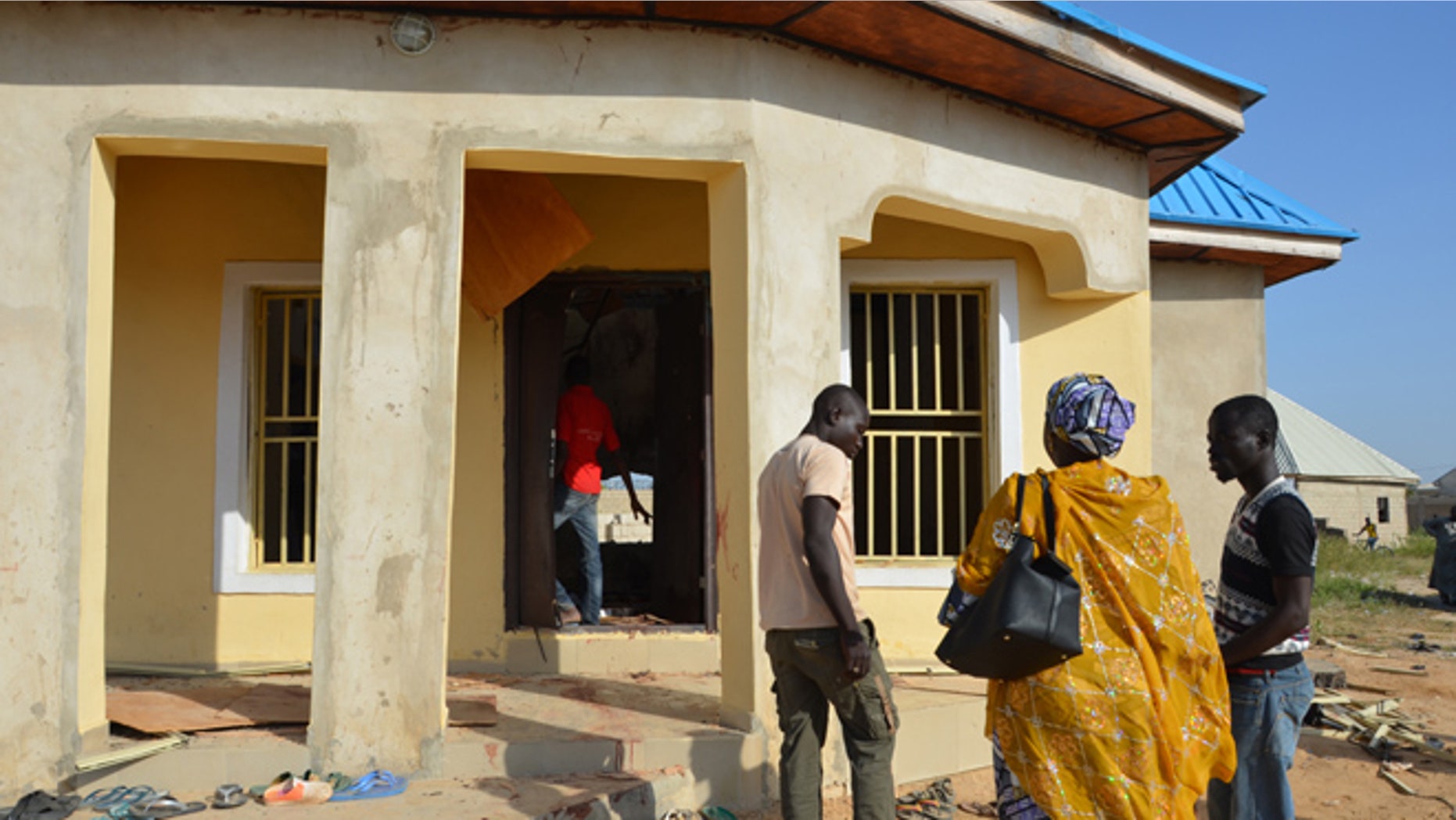 Oct. 23, 2015: People stand outside a mosque that was bombed in Maiduguri, Nigeria.