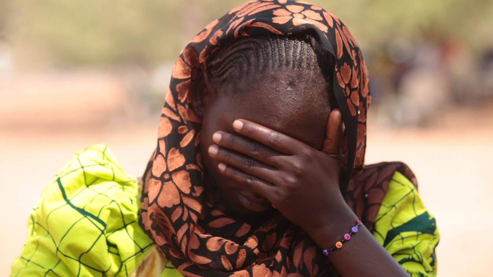 In this photo taken Saturday, Jan. 31, 2015. Dorcas Aiden, 20 years old , speaks to a journalist in Yola, Nigeria. Dorcas Aiden was another of the girls caught in Boko Haram’s siege. She had finished high school and was living at home when the war came to her village. Fighters took her to a house in the town of Gulak and held her captive for two weeks last September. The more than 50 teenage girls crammed into the house were beaten if they refused to study Quranic verses or conduct daily Muslim prayers, she says. When the fighters got angry, they shot their guns in the air. Aiden finally gave in and denied her Christian faith to become Muslim, at least in name, she says. (AP Photo/Lekan Oyekanmi)
