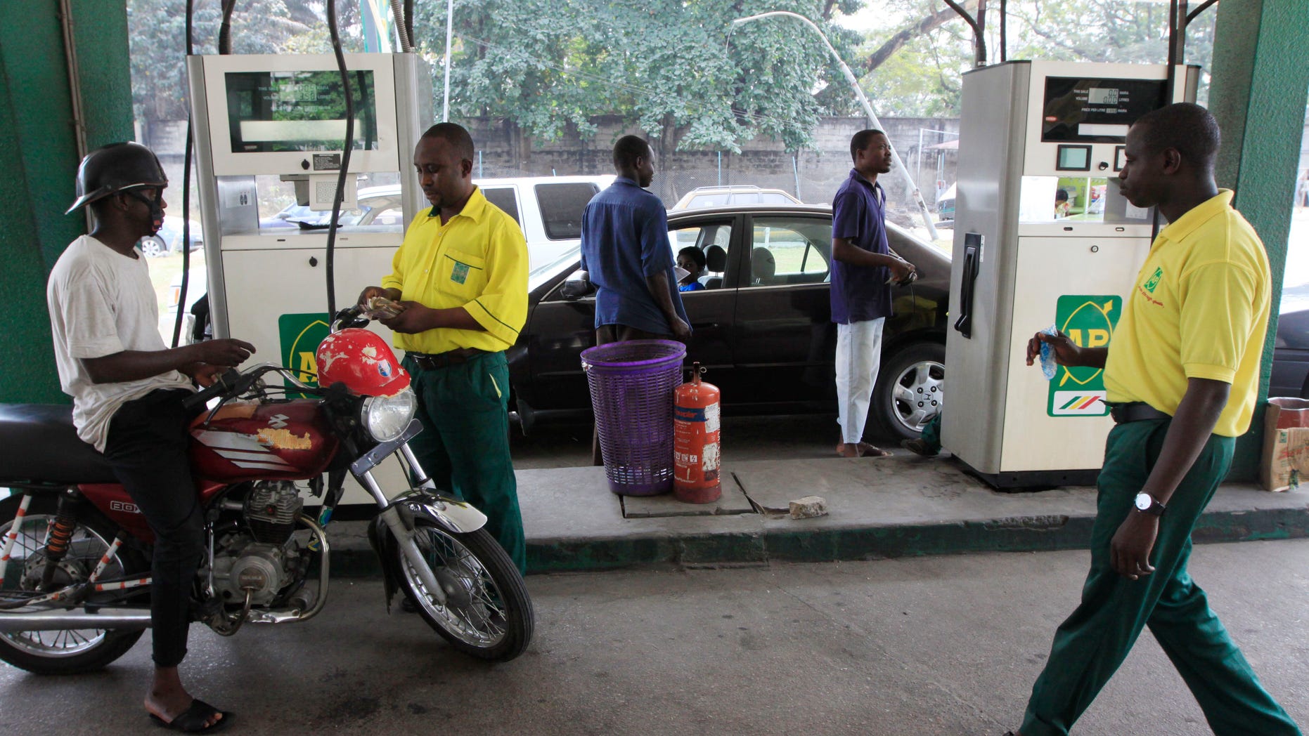 Jan. 2, 2012: People buy fuel at a petrol station in Lagos ,Nigeria.
