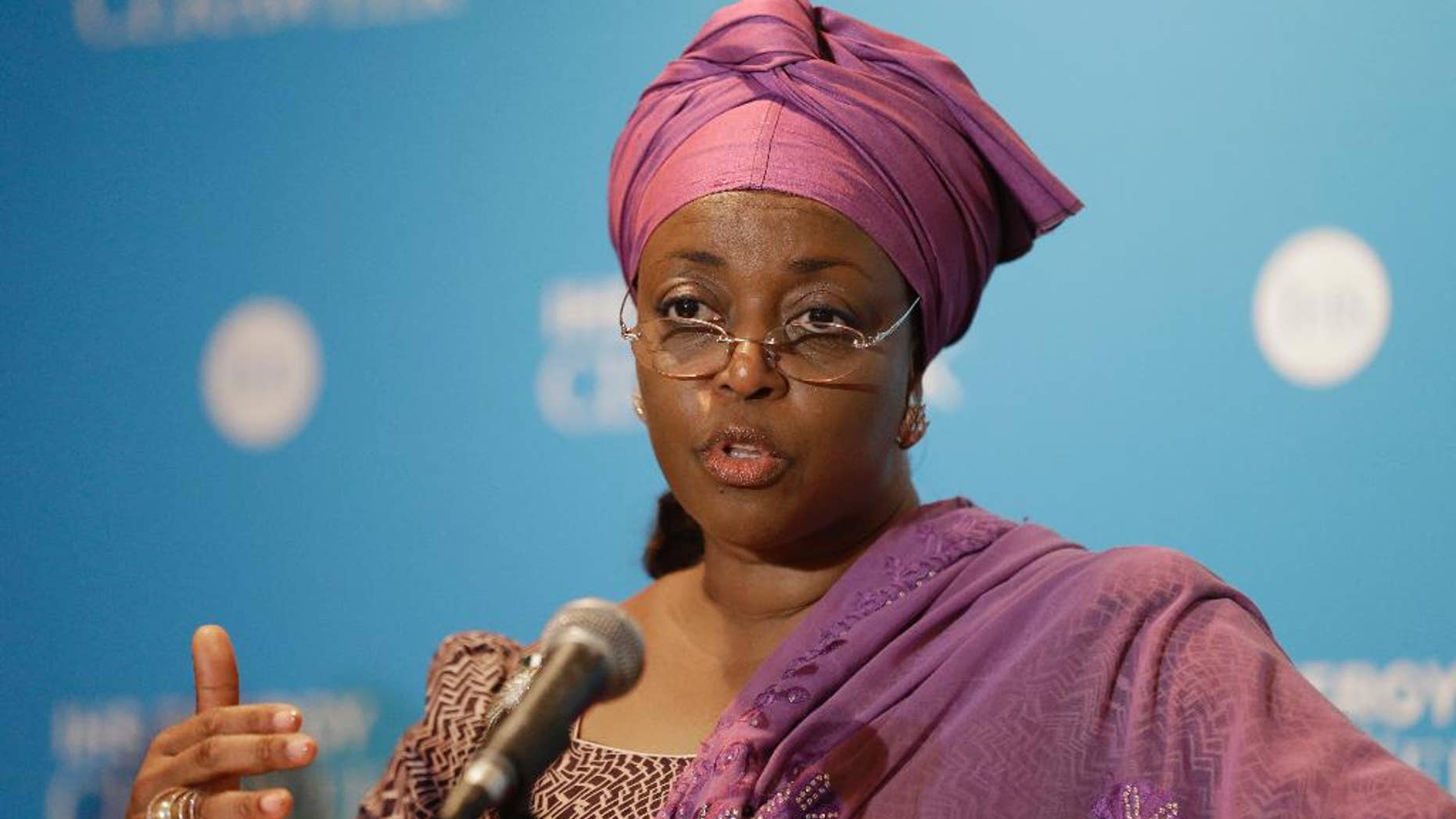 FILE- In this Tuesday, March 4, 2014 file photo, former Nigerian petroleum resources minister Diezani Alison-Madueke answers a question following a speech at the IHS CERAWeek, in Houston. The family of the former oil minister is asking Nigerians to pray for her as she fights cancer and British allegations of corruption. A statement from Diezani Alison-Madueke's lawyer denies she was arrested and says she was "merely invited" to answer questions by Britain's National Crime Agency last week. Lawyer Oscar M. Onwudiwe said Friday, Oct. 9, 2015 the family asks for Nigerians' prayers as the ex-minister undergoes surgery next week after months of chemotherapy and hopes to emerge strong enough to confront the allegations. (AP Photo/Pat Sullivan, file)