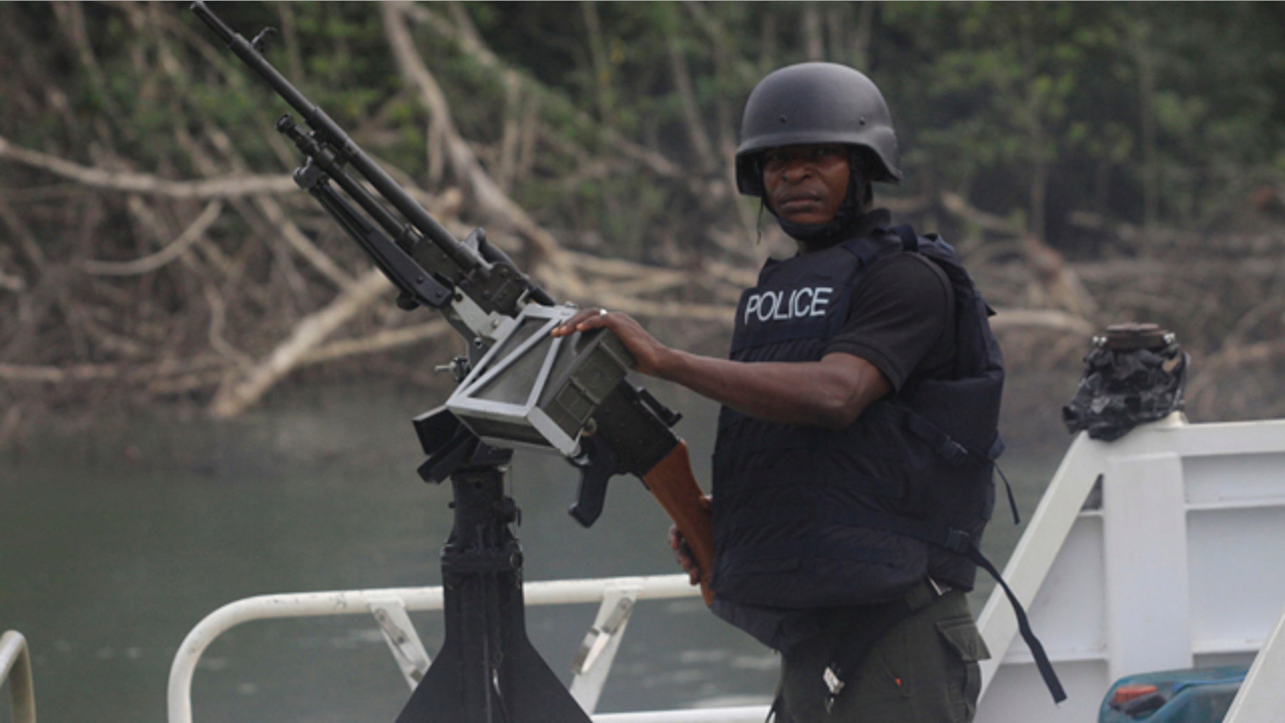 Feb. 27: A police officer mans a jetty prior to Nigeria President Goodluck Jonathan's visit to Koluama 2 village, in Nigeria.