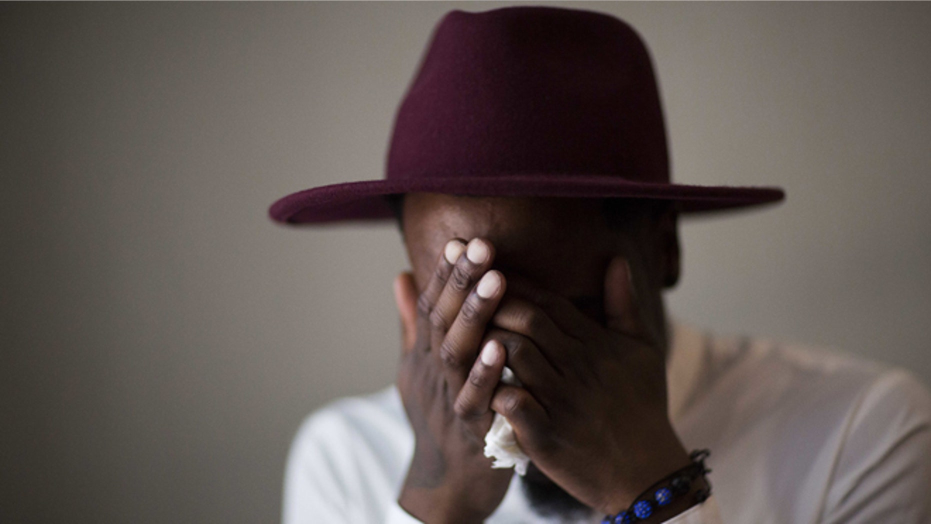 Demetrice Naulings cries while recalling how he survived the Pulse shooting on June 14, 2016, in Orlando, Fla.