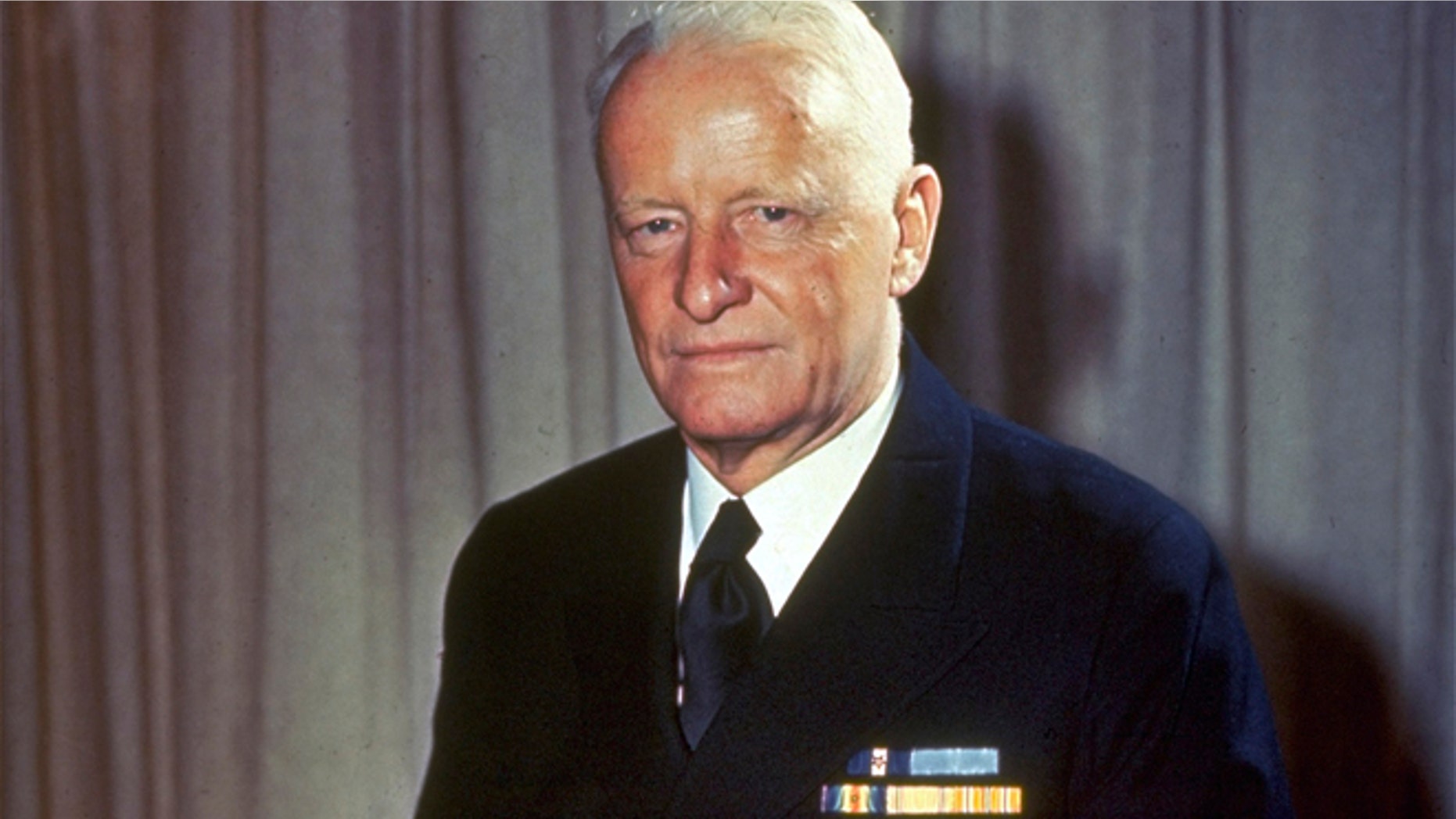 This undated file photo shows Adm. Chester W. Nimitz, commander of U.S. Naval forces in the Pacific during World War II, sitting on a desk in an unknown location.