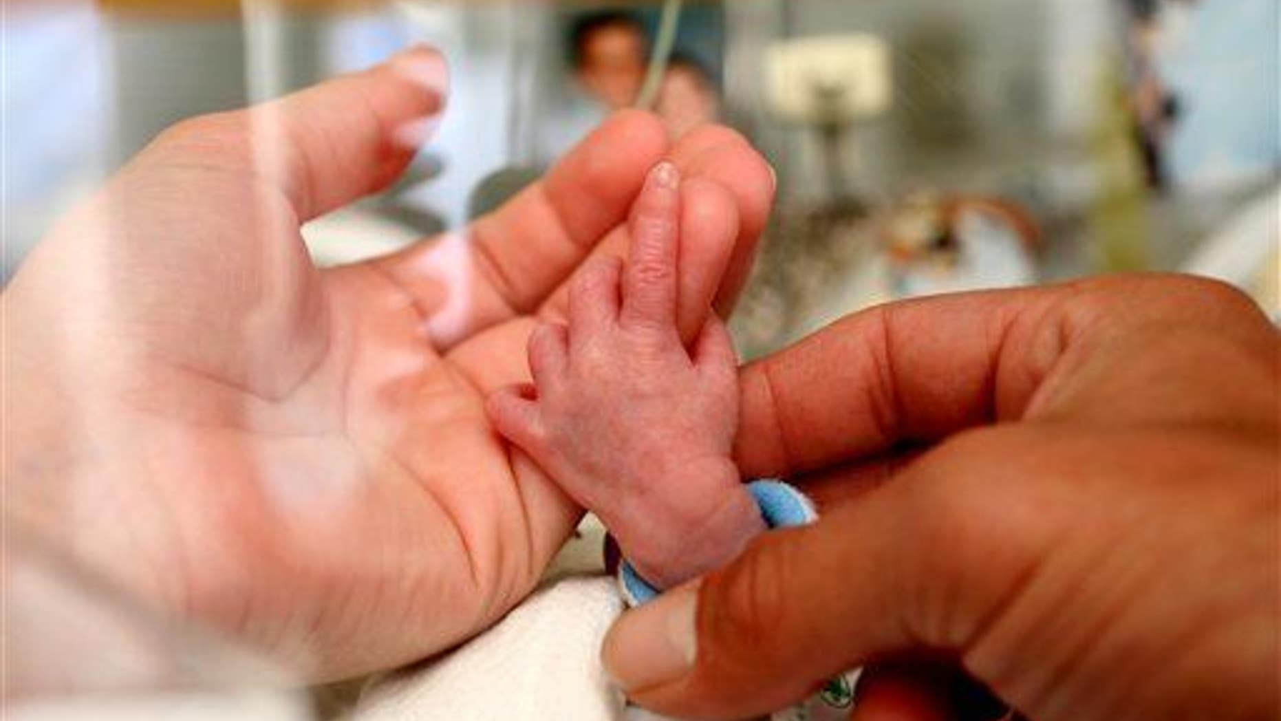 This July 25, 2006, handout photo provided by the March of Dimes Foundation shows a baby in the Neonatal Intensive Care Unit (NICU) at the Albany Medical Center in Albany, NY.