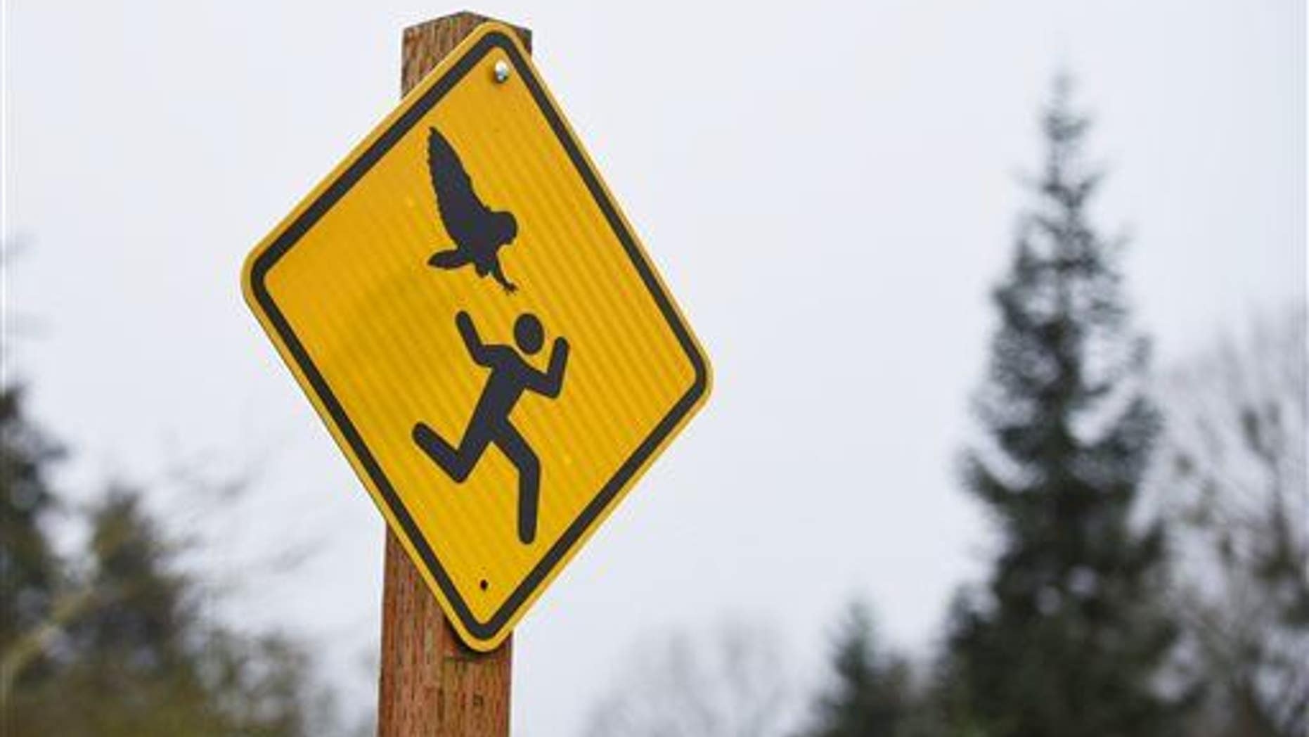 One of the new warning signs at Bush's Pasture Park in Salem, Ore.