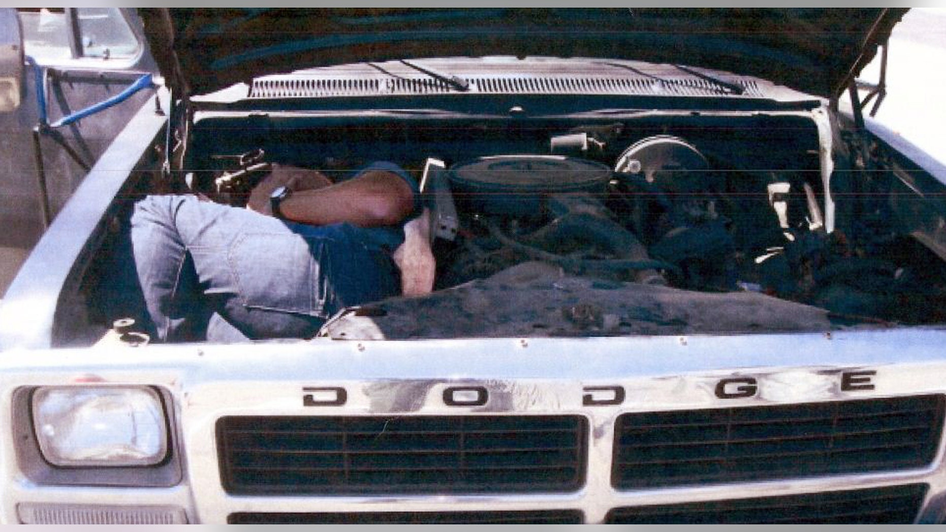 This undated image provided by the U.S. Immigration and Customs Enforcement (ICE) shows an individual smuggled inside the engine compartment discovered at the U.S. border. Five people were indicted Thursday Feb. 2, 2012 in connection with an alleged human smuggling ring that used non-Spanish-speaking, African-American drivers to shuttle illegal immigrants from the border in a bid to elude detection, authorities said.(AP Photo/ICE)