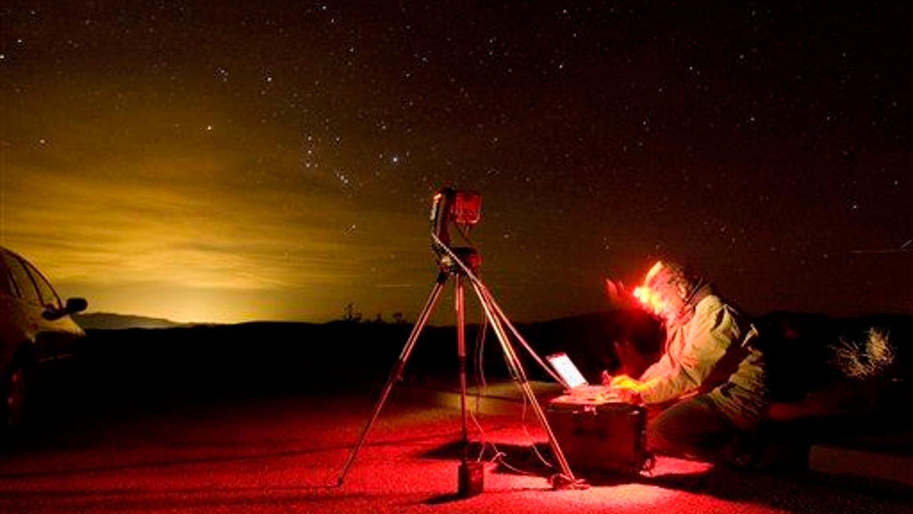 A photographer snaps the night sky with a special computer controlled camera in Death Valley National Park, Calif.