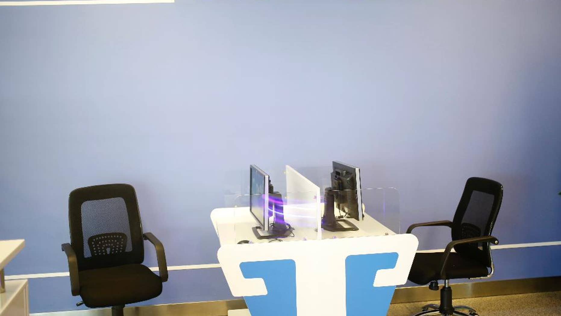 In this Monday, Aug. 24, 2015 photo, computers with no keyboard provided are seen at an Internet corner at the airport in Pyongyang, North Korea. The new airport building has just about everything including the Internet room. The problem is, it doesn't seem to work. (AP Photo/Dita Alangkara)