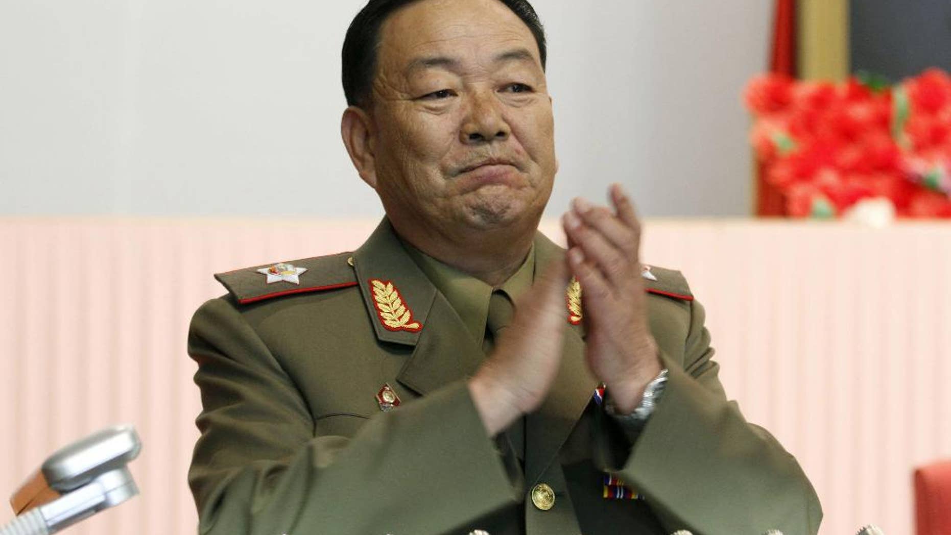 FILE - In this July 18, 2012, file photo, then Vice Marshal Hyon Yong Chol applauds during a meeting in Pyongyang, North Korea. North Korean leader Kim Jong Un ordered his defense chief Hyon Yong Chol executed with an anti-aircraft gun for complaining about the young ruler, talking back to him and sleeping during a meeting presided over by Kim, South Korea's spy agency told lawmakers Wednesday, May 13, 2015, citing what it called credible information. (AP Photo/Jon Chol Jin, File)