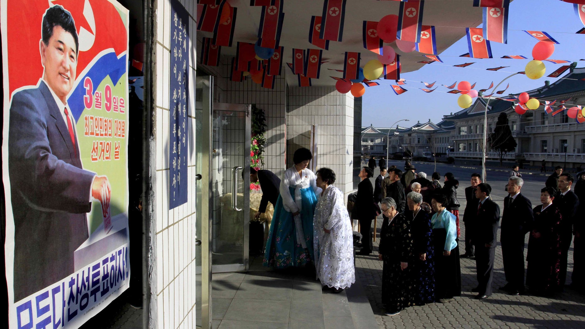 March 9, 2014 - Voters line up to cast their ballots to elect deputies to the 13th Supreme People's Assembly in Pyongyang, North Korea. North Korean voters went to polling stations to elect a new national legislature, although they don't get to choose who to vote for since there is only one candidate per district.