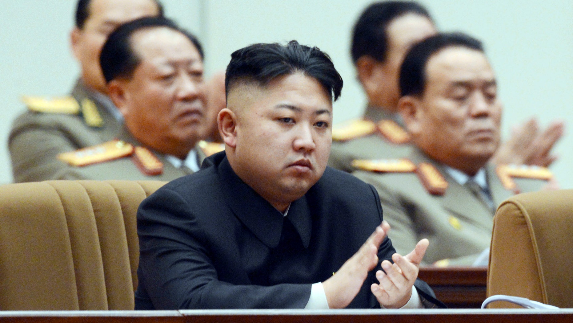 North Korean leader Kim Jong Un claps his hands as he attends a national memorial service on the eve of the anniversary of Kim Jong Il's death in Pyongyang, North Korea, Sunday, Dec. 16, 2012. (AP Photo/Kyodo News) JAPAN OUT, MANDATORY CREDIT, NO LICENSING IN CHINA, HONG KONG, JAPAN, SOUTH KOREA AND FRANCE