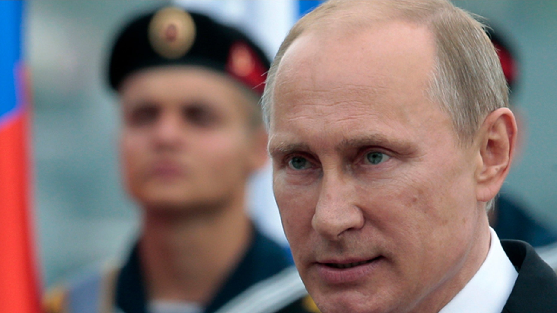 FILE - In this May 9, 2014 file photo, Russian President Vladimir Putin heads to speak at a navy parade marking Victory Day in Sevastopol, Crimea. (AP Photo/Ivan Sekretarev, File)