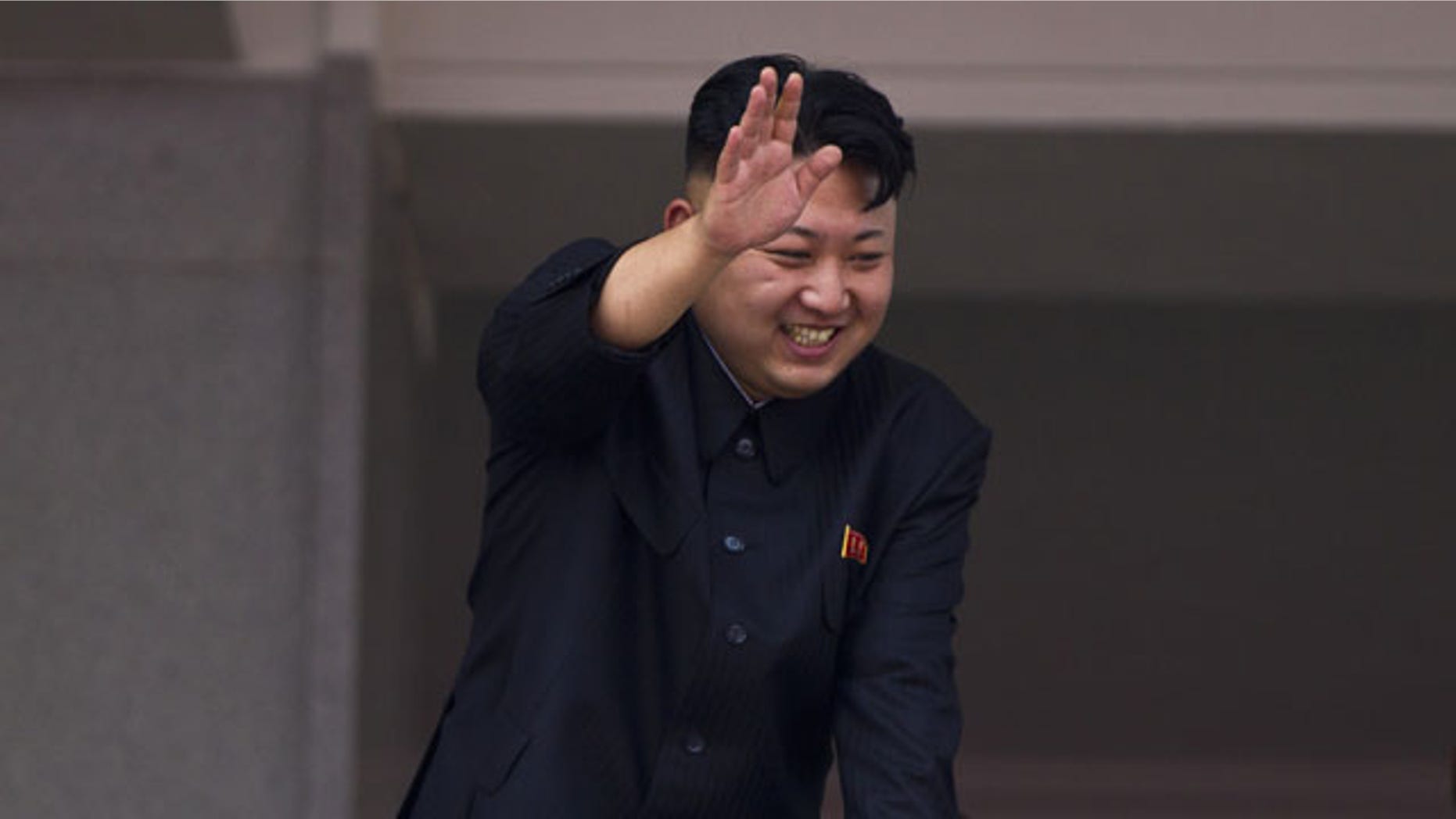 FILE - In this July 27, 2013 file photo, North Korean leader Kim Jong Un leans over a balcony and waves to Korean War veterans cheering below at the end of a mass military parade on Kim Il Sung Square in Pyongyang to mark the 60th anniversary of the Korean War armistice. (AP Photo)