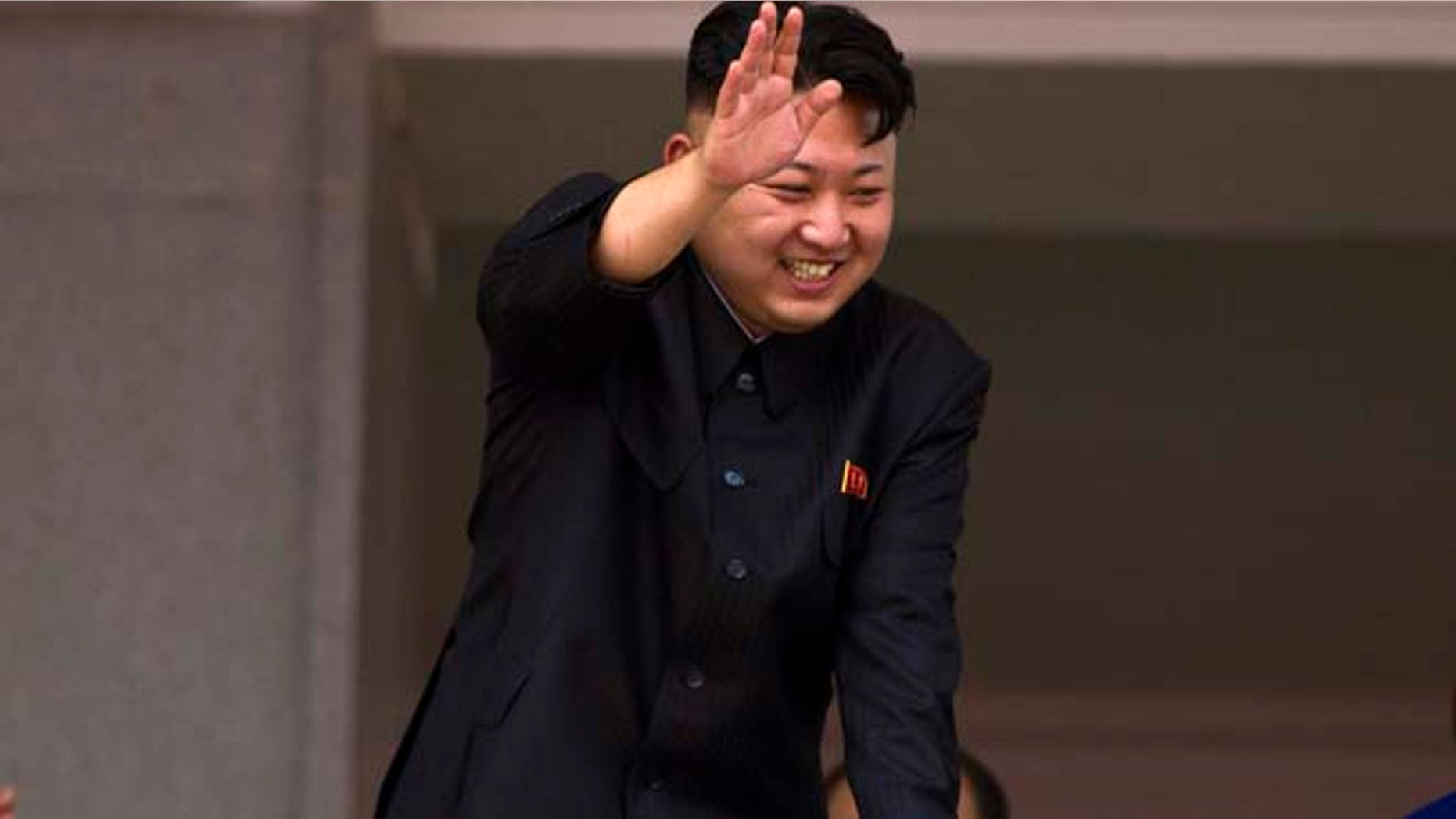July 27, 2013: In this file photo, North Korean leader Kim Jong Un leans over a balcony and waves to Korean War veterans cheering below at the end of a mass military parade on Kim Il Sung Square in Pyongyang to mark the 60th anniversary of the Korean War armistice. (AP)