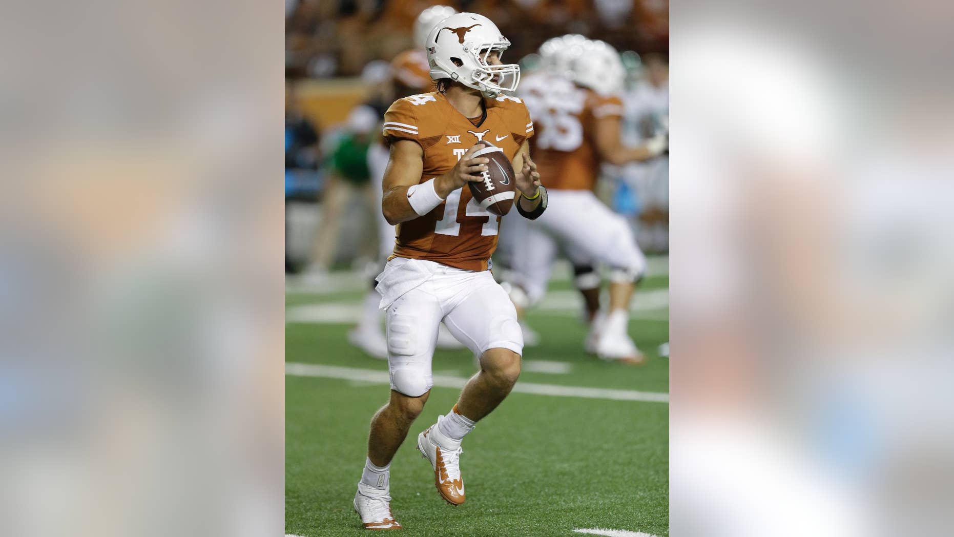 Texas' David Ash (14) looks to throw against North Texas during the second half of an NCAA college football game, Saturday, Aug. 30, 2014, in Austin, Texas. (AP Photo/Eric Gay)