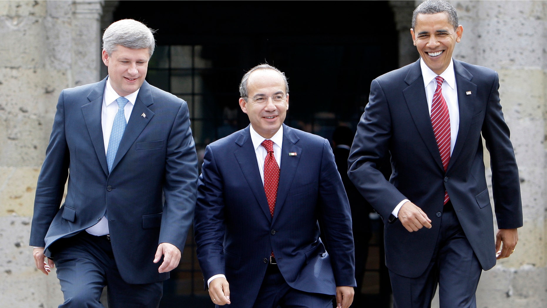 In this Aug. 10, 2009, photo, President Barack Obama, right, Mexico's President Felipe Calderon, center, and Canada's Prime Minister Stephen Harper walk towards a stand for an official photo in Guadalajara, Mexico, for a North American summit. (AP Photo/Alex Brandon, File)