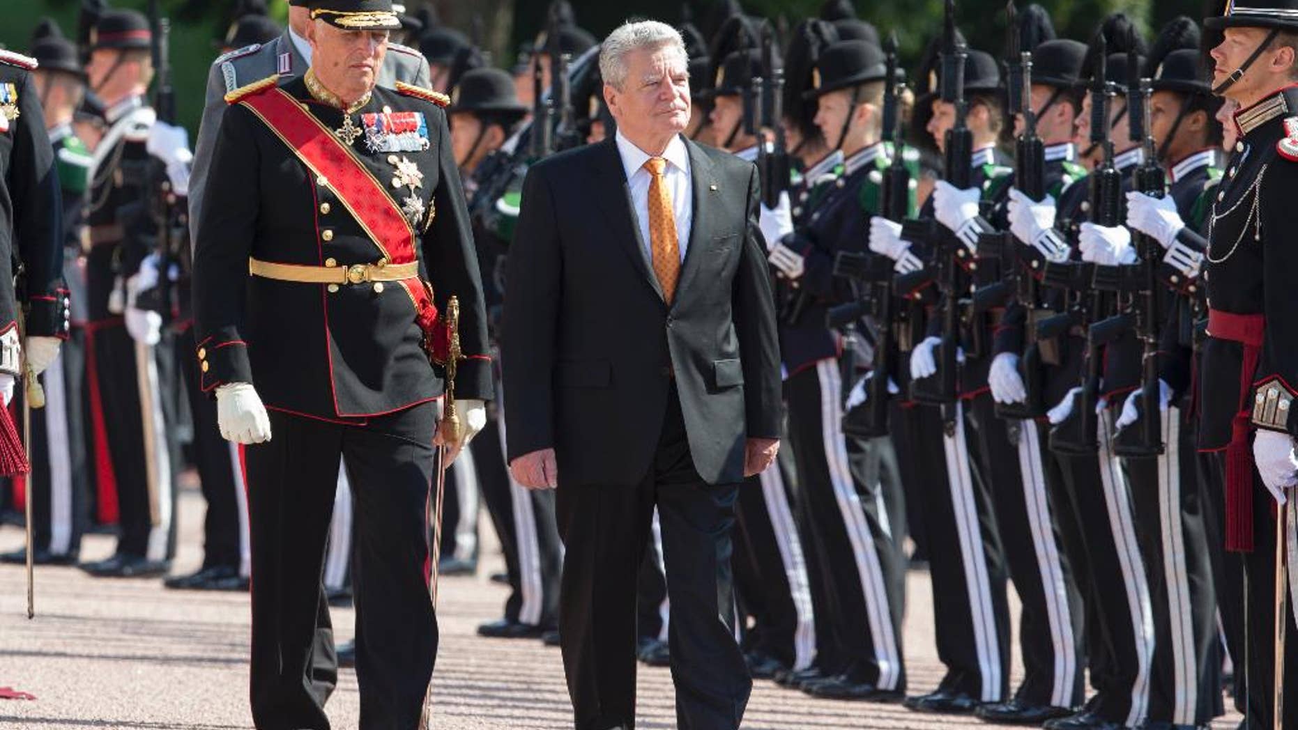 German president Joachim Gauck, right, arrives for a three-day state visit to Norway, Wednesday, June 11, 2014. He was met outside the Royal Palace in Oslo by Norwegian King Harald, left. (AP Photo/ NTB Scanpix, Berit Roald)