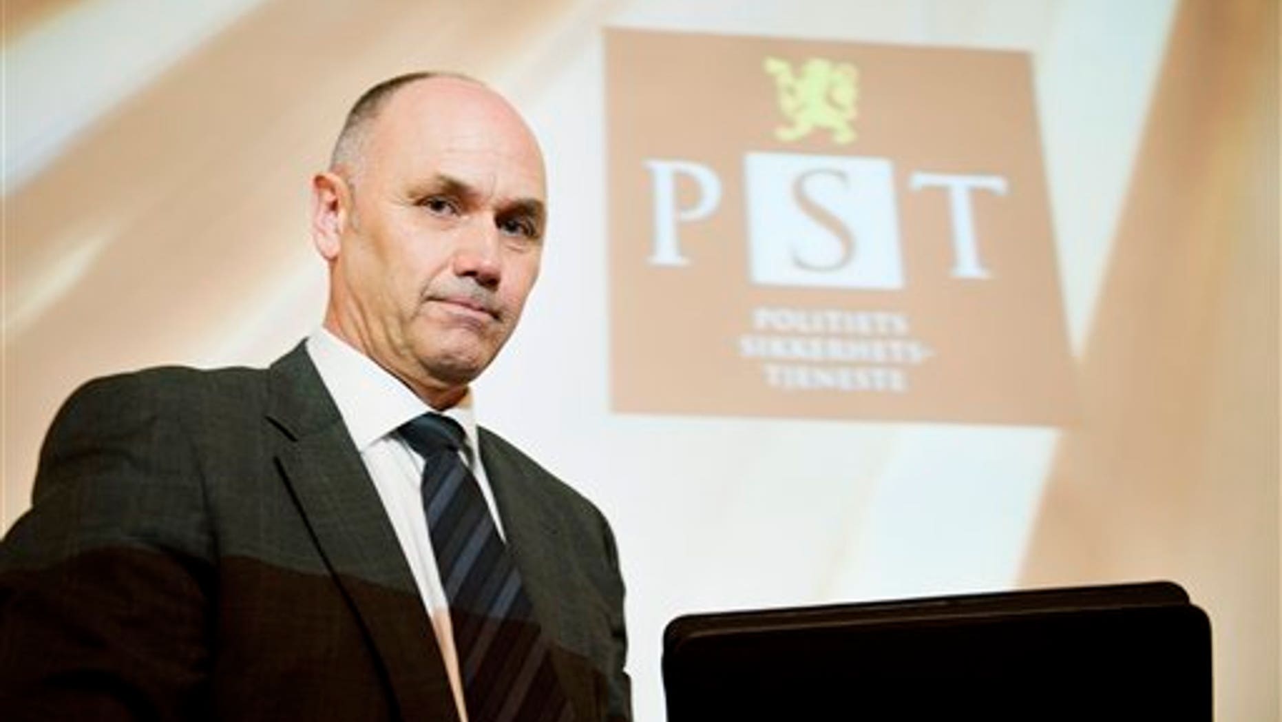 March 16, 2012: A projection causing striation on the face of acting head of Norway's domestic intelligence service PST, Roger Berg, as he faces the media.