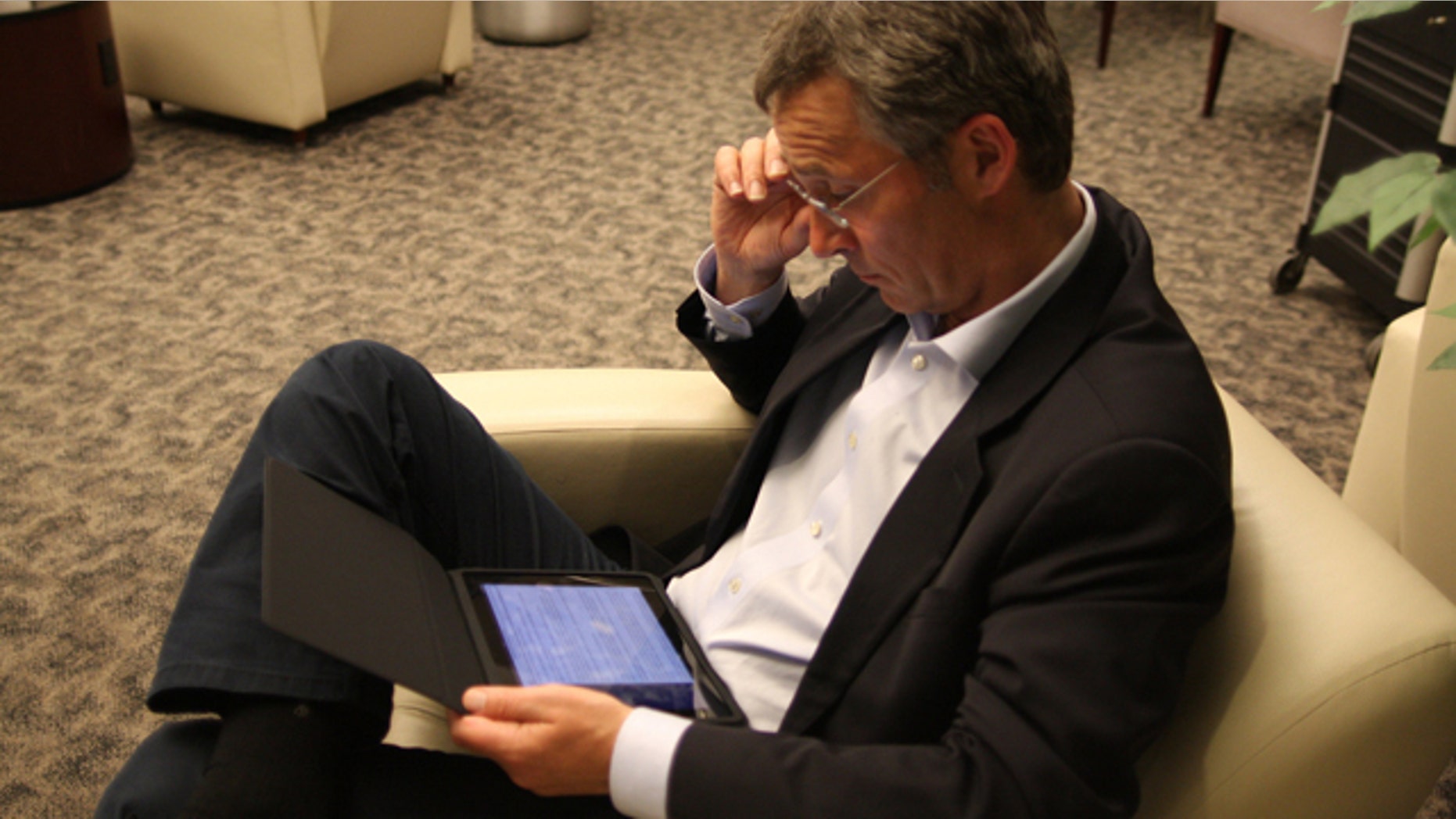 A photo taken by the Prime Minister's office, shows Jens Stoltenberg managing the country from New York via his new iPad