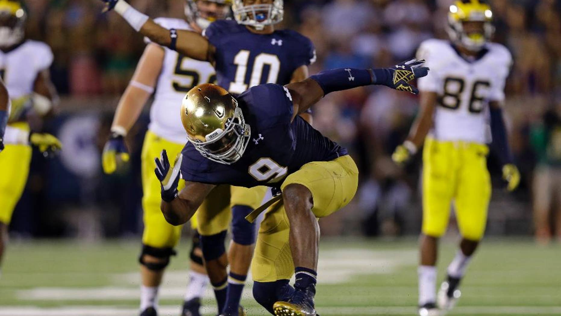 FILE - In this Sept. 6, 2014, file photo, Notre Dame linebacker Jaylon Smith celebrates a tackle for a loss against Michigan during the second half of an NCAA college football game in South Bend, Ind. Jaylon Smith is always up for a challenge. Now, the Notre Dame linebacker must assume greater leadership with Joe Schmidt out for the season and the No. 8 Fighting Irish next facing No. 11 Arizona State on the road. (AP Photo/Michael Conroy, File)