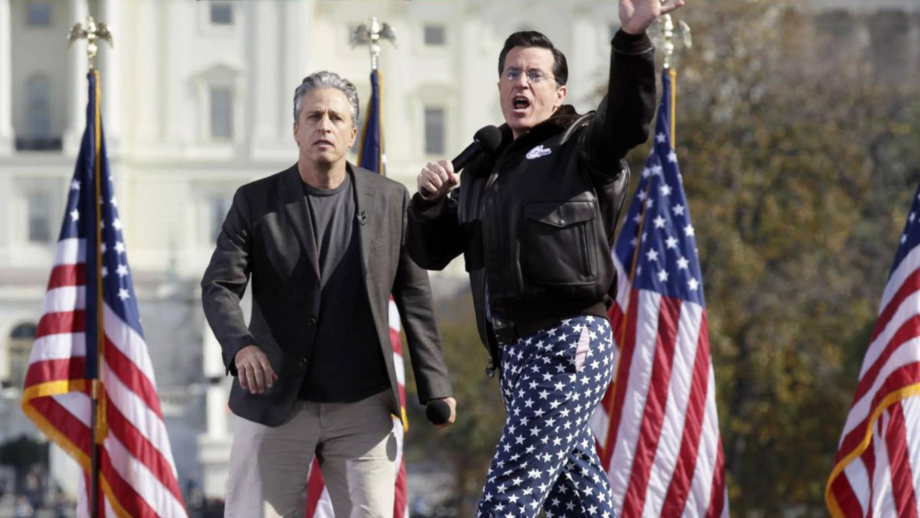 John Stewart and Stephen Colbert at Restoring Sanity and/or Fear Rally Sunday/AP photo