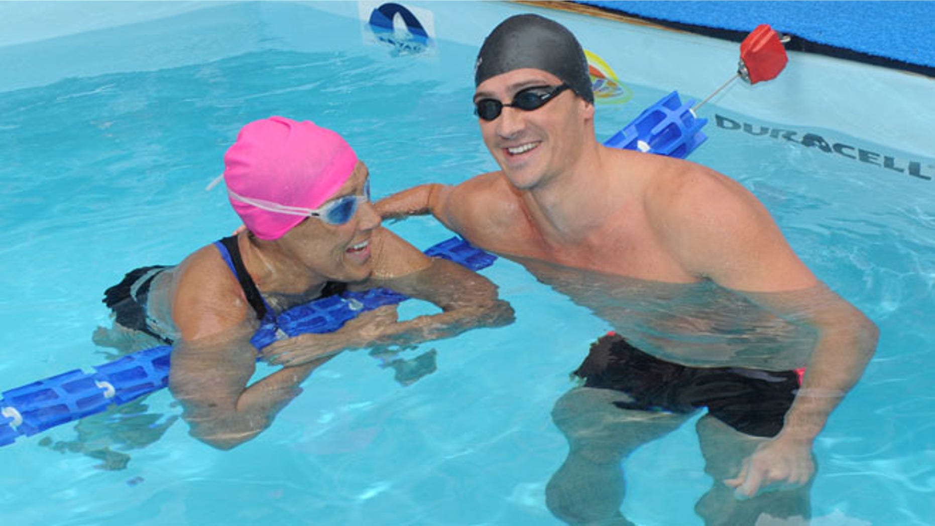 Eleven-time Olympic medalist Ryan Lochte swims with Diana Nyad during her 48-hour continuous "Swim for Relief" to support Hurricane Sandy recovery efforts in New York's Herald Square.