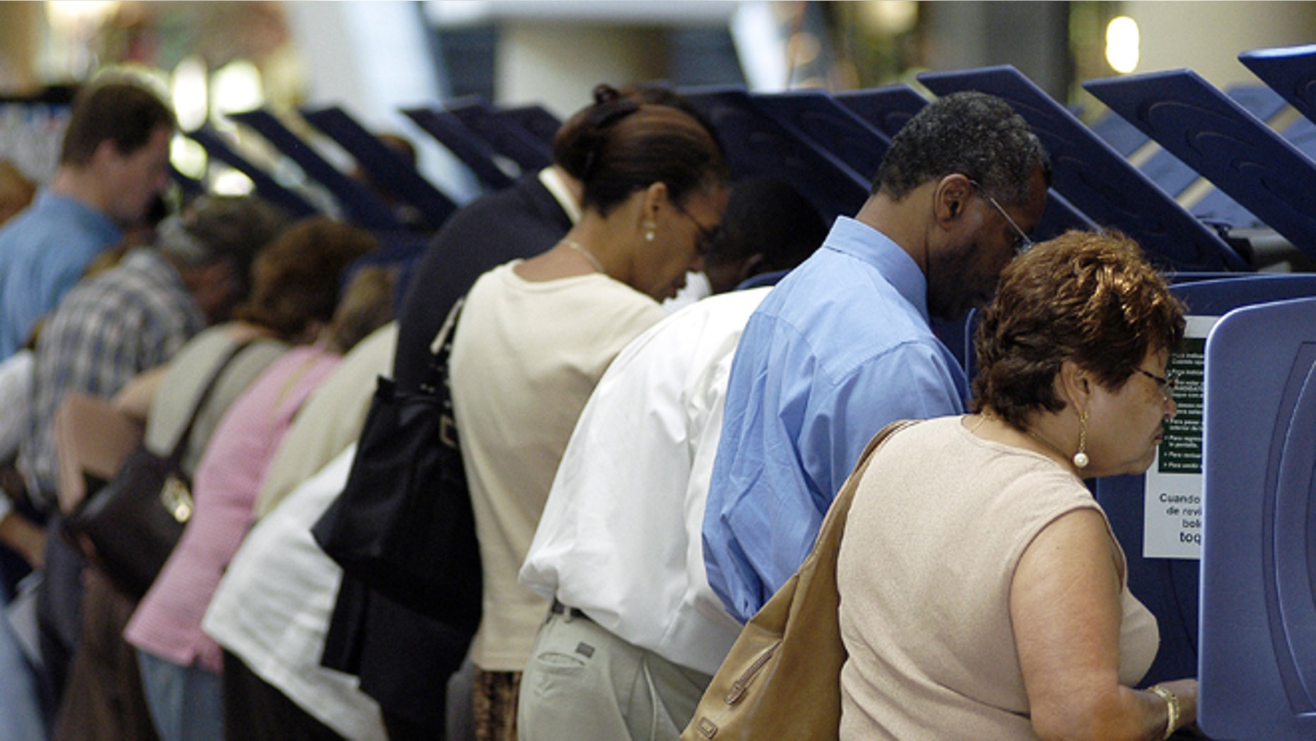 MIAMI - OCTOBER 21: Hispanic voters go to the polls for early voting at the Miami-Dade Government Center on October 21, 2004 in Miami, Florida. Early voting began this week in Florida and is under heavy scrutiny after the debacle in the 2000 election. (Photo by G. De Cardenas/Getty Images)