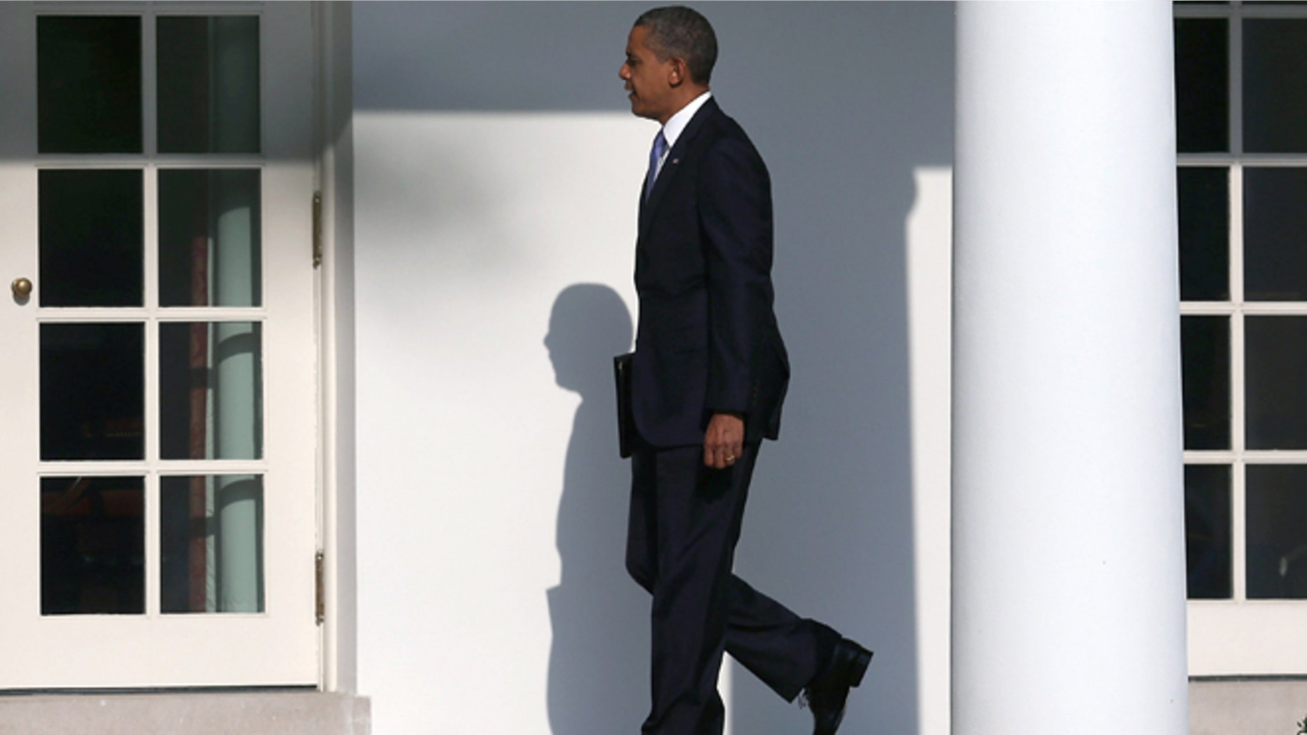 WASHINGTON, DC - AUGUST 21: U.S. President Barack Obama walks toward the Oval Office before departing on Marine One at the White House, on August 21, 2012 in Washington, DC. President Obama is traveling to Ohio, Nevada and New York to continue campaigning. (Photo by Mark Wilson/Getty Images)