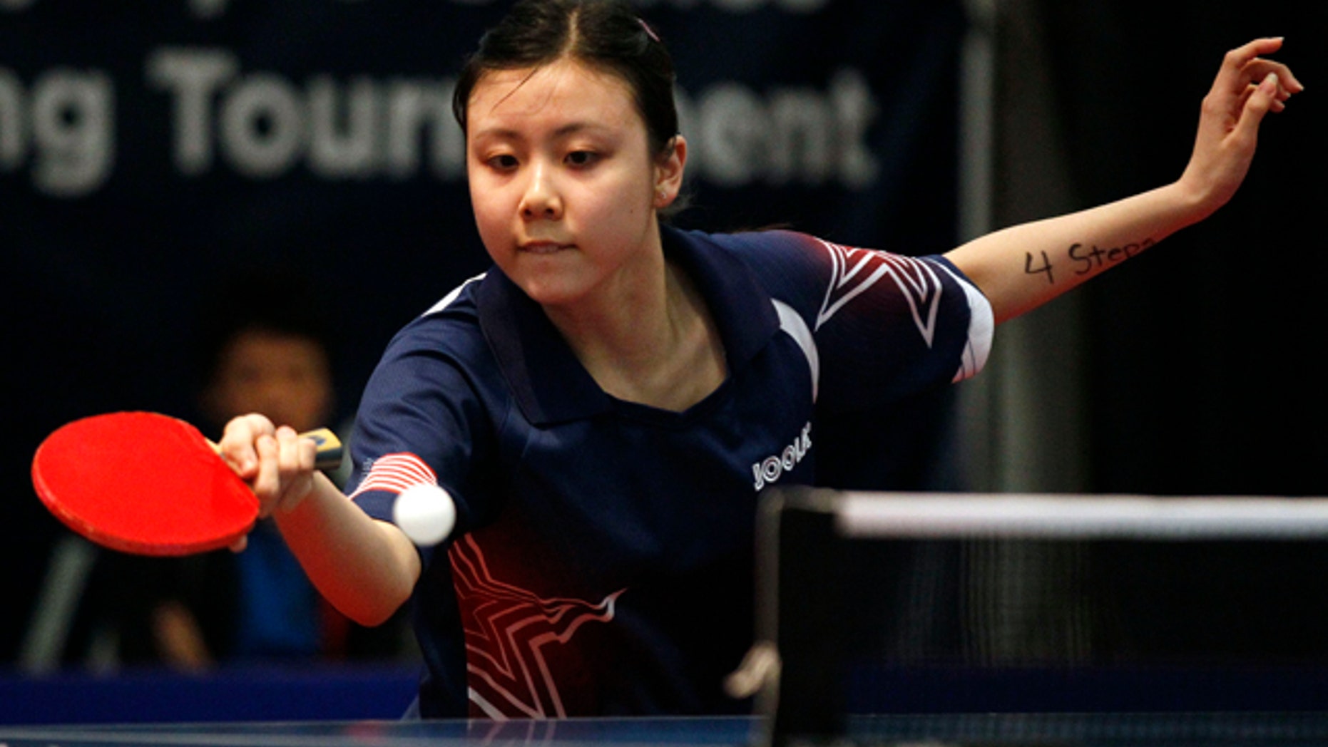 April 20, 2012: This Friday file photo shows United States' Ariel Hsing with her eye on the ball against Canada's Chris Xu during the final women's singles match of the North America Olympic Games table tennis qualifying tournament in Cary, N.C.