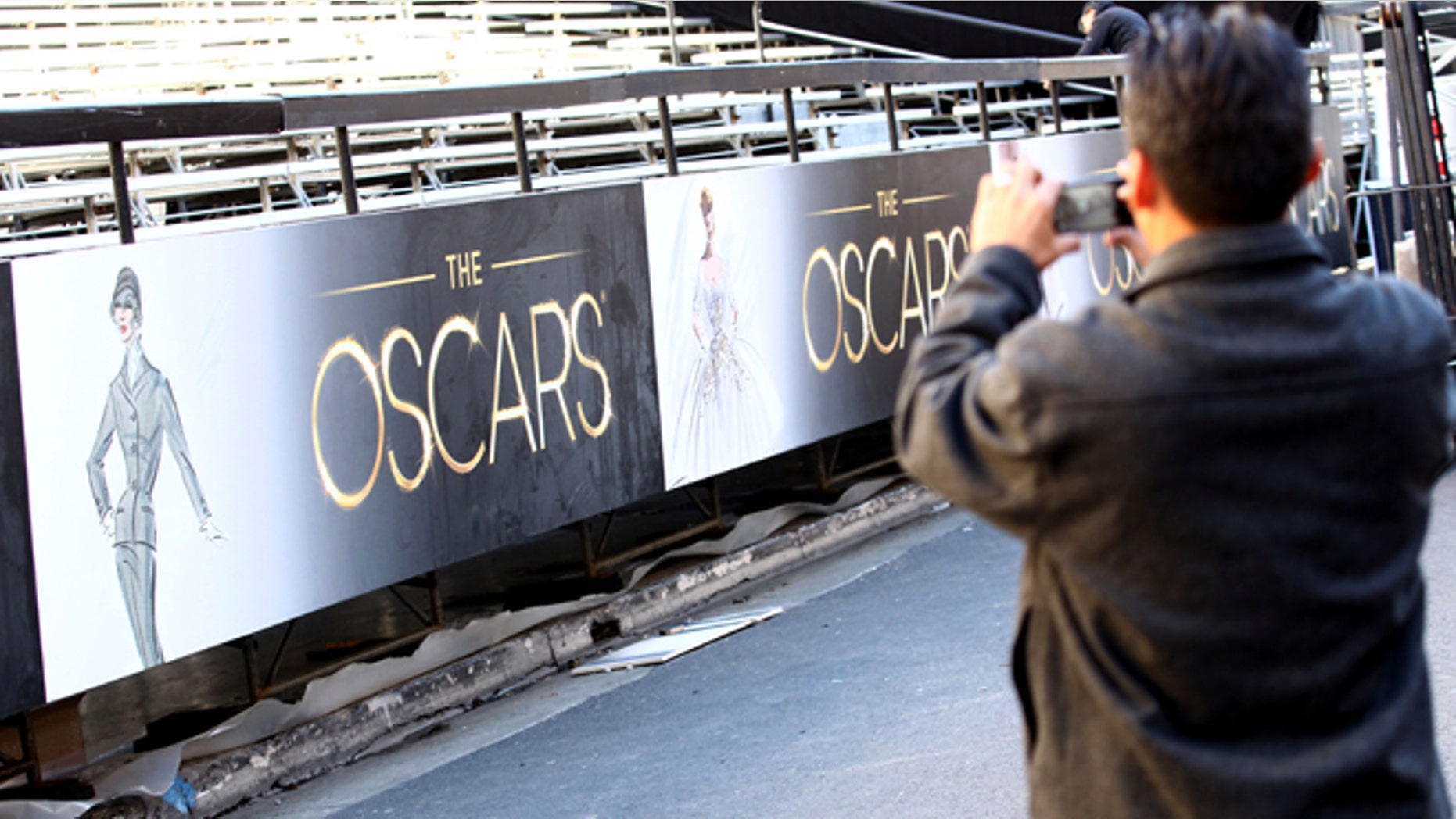 A member of the press takes a picture as preparations are made for the 85th Academy Awards in Los Angeles, Wednesday, Feb. 20, 2013. The Academy Awards will be held at the Dolby Theatre on Sunday. (Photo by Matt Sayles/Invision/AP)