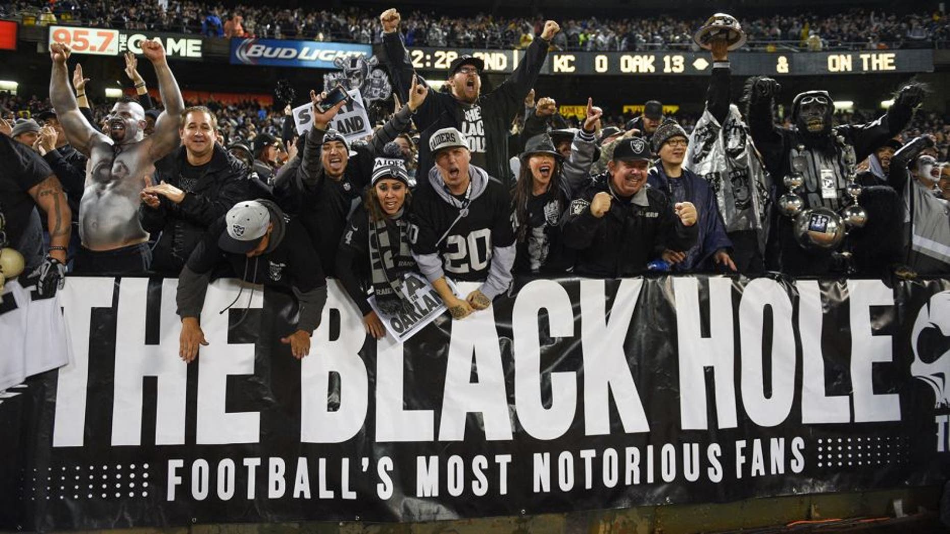 November 20, 2014; Oakland, CA, USA; Oakland Raiders fans celebrate during the second quarter against the Kansas City Chiefs at O.co Coliseum. Mandatory Credit: Kyle Terada-USA TODAY Sports