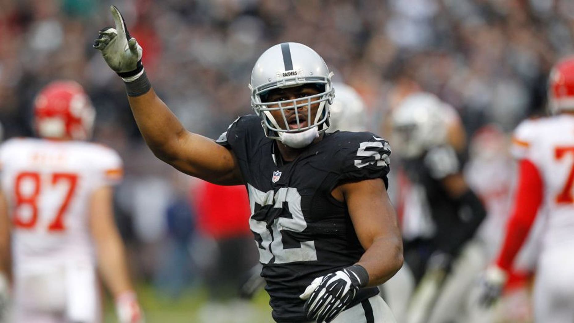 Dec 6, 2015; Oakland, CA, USA; Oakland Raiders outside linebacker Khalil Mack (52) reacts after the Kansas City Chiefs missed an extra point attempt in the fourth quarter at O.co Coliseum. The Chiefs defeated the Raiders 34-20. Mandatory Credit: Cary Edmondson-USA TODAY Sports