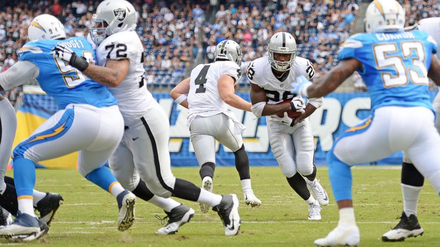 Oct 25, 2015; San Diego, CA, USA; Oakland Raiders running back Latavius Murray (28) runs for a touchdown during the first quarter against the San Diego Chargers at Qualcomm Stadium. Mandatory Credit: Jake Roth-USA TODAY Sports
