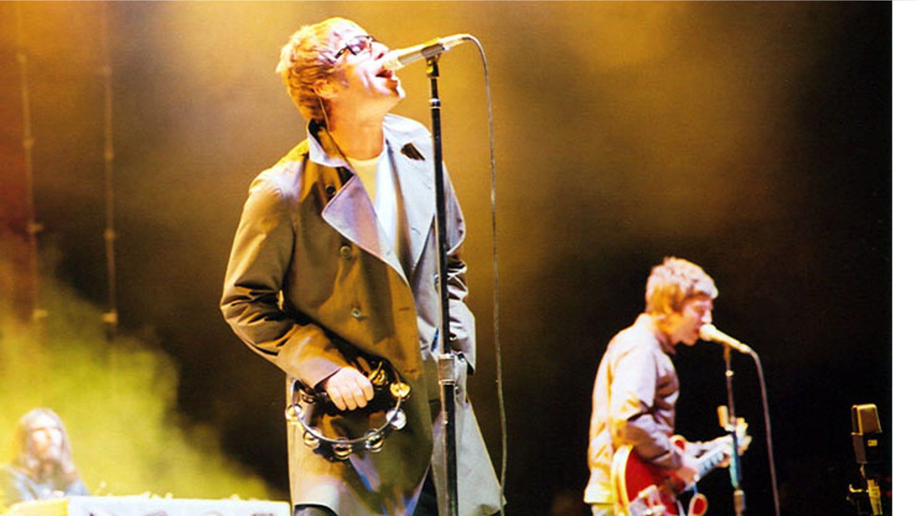 Vocalist Liam Gallagher, guitarist Noel Gallagher and, keyboardist Jay Darlington in background in 2005.