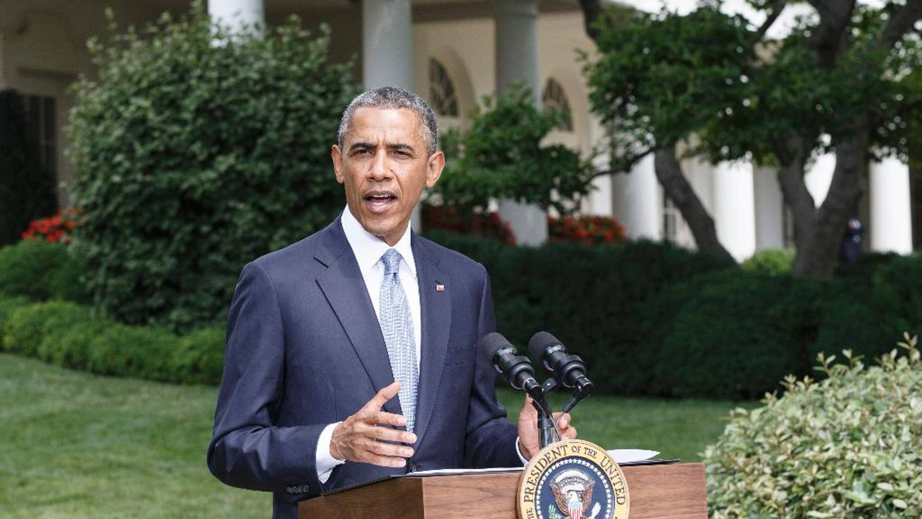 President Barack Obama makes a statement on the situation in Ukraine and Gaza, at the White House in Washington, Monday, July 21, 2014. (AP Photo/J. Scott Applewhite)