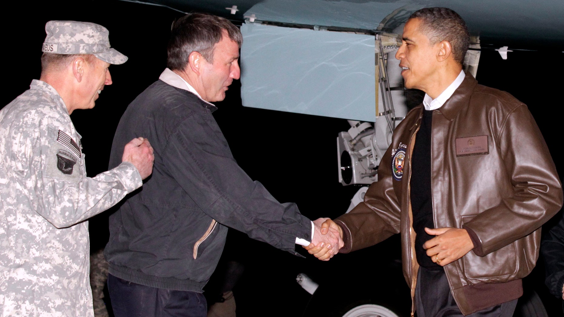 Dec. 3: Obama is greeted by Gen. David Petraeus, left, and US Ambassador to Afghanistan Karl W. Elkenberry, center, after stepping off Air Force One during an unannounced visit to Bagram Air Field in Afghanistan.