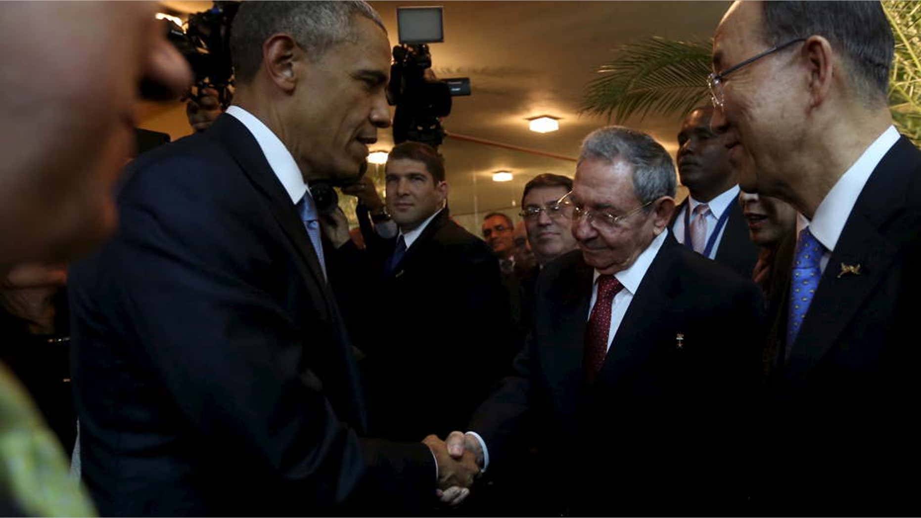 April 10, 2015: U.S. President Barack Obama (L) and his Cuban counterpart Raul Castro shake hands as U.N. Secretary General Ban Ki-moon (R) looks on, before the inauguration of the VII Summit of the Americas in Panama