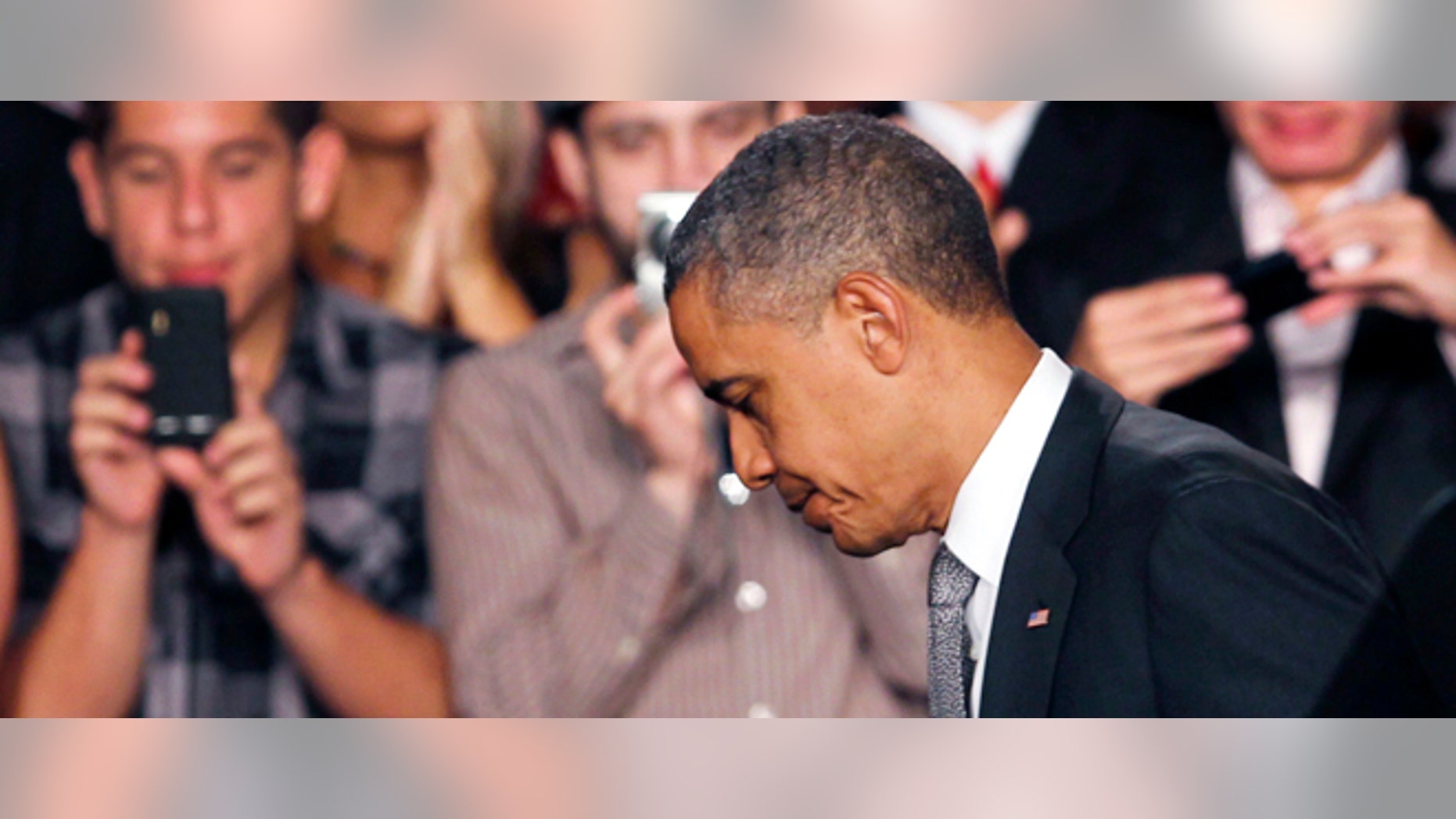 FILE: Friday, July 20, 2012: President Barack Obama after speaking in Ft. Meyers, Fla., about the Aurora, Colo., mass shooting.